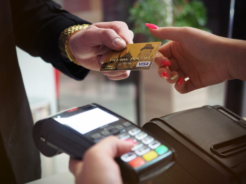 money-man-handing-woman-credit-card-with-handheld-credit-card-machine